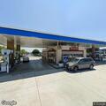 Man arguing and throwing items at gas station