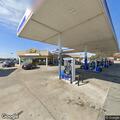 Officer follows black sedan from gas station