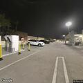 Person living in car in parking garage