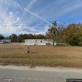 Chained dog hinders survey crew behind Muldrow Street