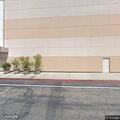 Person experiencing back pain at Macy's main entrance