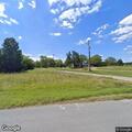 Small burn pile near house on Highway 128