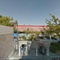 Officers check vehicle behind BK Liquor store