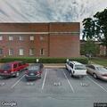 Man lying roadside clutching chest near Berry College