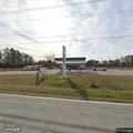 Officer stops vehicle at Northwest Gas and More