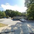 Large tree limb blocking road near diner