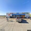 Officers check vehicle at Chevron gas station