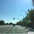 Banners on overpass creating traffic visual hazard