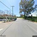 Suspicious person hiding in bushes near intersection