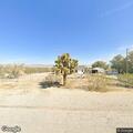 Person experiencing abdominal pain in Lucerne Valley