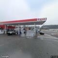 Disabled red sedan at Redfield gas station
