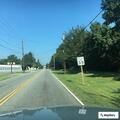 Officer checks on man walking near Biscuit Barn
