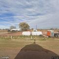 Grass fire near structure on Fort Sumner Canal Road