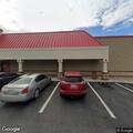 Officer stops white Chrysler van at Foodland