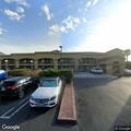 Person experiencing abdominal pain at Econo Lodge