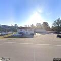 Pregnant woman with abdominal pain in white SUV