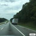 Officer escorting driver to highway exit