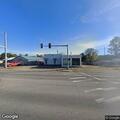 Stalled truck with lumber trailer blocks turning lane