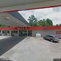 Woman possibly asleep in car at gas station pump