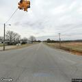 Person needing help sitting in roadway at intersection