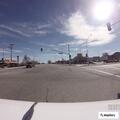 Man lighting dumpster on fire at intersection