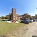 Person fighting with self at church front door