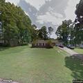 Person with severe back pain at residence