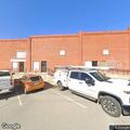 Person twitching and slumped over in parking lot