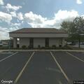 Traffic stop on red Dodge Charger at bank