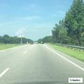 Man in orange shirt staggering on highway near Maxton