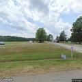 Elderly person checked for injuries at skydive center