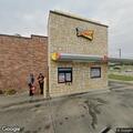 Officer checks parked vehicle at closed Sonic