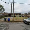 Officers check back door at Morgan Street home