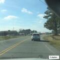 Stranded vehicle stopped in middle of roadway