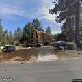 Leaning utility pole creates road hazard on Edgewood