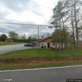 Person stuck in seatbelt in driveway vehicle