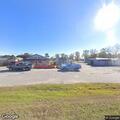Abandoned damaged truck left running in parking lot