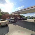 Officer checks person behind Speedway store