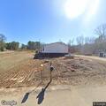 female needs assistance after sliding on floor in iuka