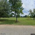 Suspicious vehicle with person walking in park