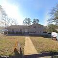 Officer checks report of person hiding behind clinic