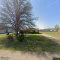 Complaint of items dumped in yard in Hughes
