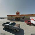 Middle-aged man holds chest at Joseph City truck stop