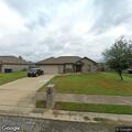 Police car found with door open at residence