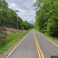 Trash cans placed in roadway causing hazard