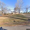 Neighbor damages vehicle and may have guns