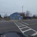 Person standing in roadway causing traffic hazard