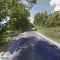 Dirt bike crash with rider down in roadway