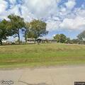 Brush pile fire threatens building on Ridge Road