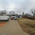 Older man walking in road near Midland Drive